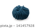 Soft teal yarn coiling elegantly on a smooth surface, ready for artistic creation and cozy projects 141457928