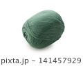 Soft green yarn sits cozily, inviting creativity and warmth for cozy projects on a peaceful crafting afternoon 141457929
