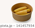 Fresh baby corn ready for culinary delight in a warm kitchen setting 141457934