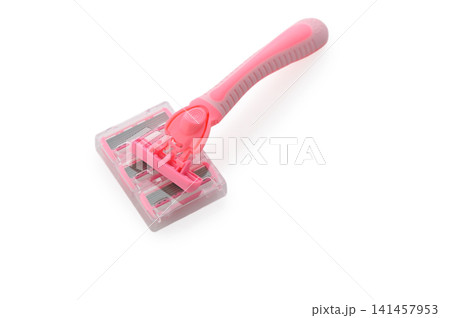 Bright pink grooming tool rests on a clean, white surface aimed at promoting a smooth and effortless pet care experience 141457953
