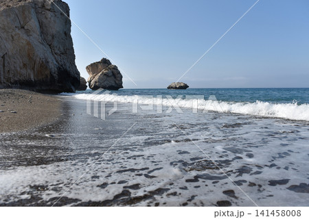 Aphrodite Rock sea stacks rising from the Mediterranean waters by a pebble beach, Cyprus Aphrodite Rock sea stacks rising from the Mediterranean waters by a pebble beach, Cyprus 141458008