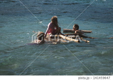 Children Enjoy Raft Adventure on the Water Children Enjoy Raft Adventure on the Water 141459647