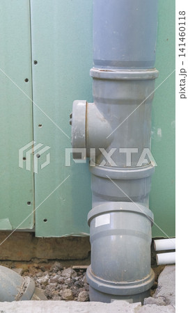 Part of a PVC sewerage system, renovation or construction work inside the building between floors. Repair of WC room, toilets restoration. Plumbing waste water 141460118