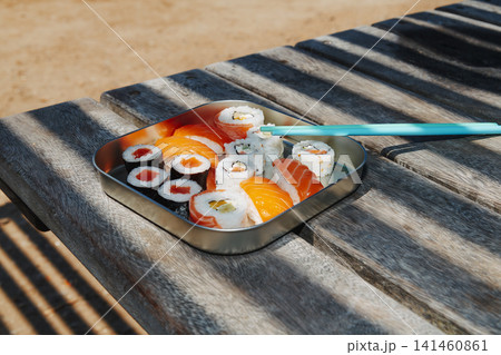 a tray of sushi in bright sunlight a tray of sushi in bright sunlight 141460861