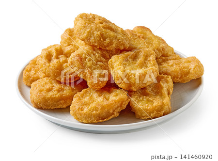 Crispy fried chicken nuggets served on plate isolated on white background Crispy fried chicken nuggets served on plate isolated on white background 141460920