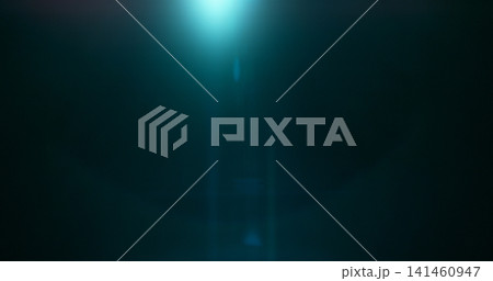 Abstract cinematic lens flare overlay with soft blue light rays, subtle optical glow and dark background. Premium VFX element for compositing, film editing, titles and motion graphics. 141460947