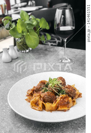Prupetti sicilan Polpette In Sugo meatballs in ragu tomato sauce with Pappardelle pasta in Sicily restaurant Prupetti sicilan Polpette In Sugo meatballs in ragu tomato sauce with Pappardelle pasta in Sicily restaurant 141461551