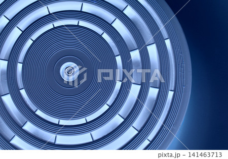 Abstract Precision Circle Texture With Blue Backlit Of Same Segments On Dark Blue Background Abstract Precision Circle Texture With Blue Backlit Of Same Segments On Dark Blue Background 141463713