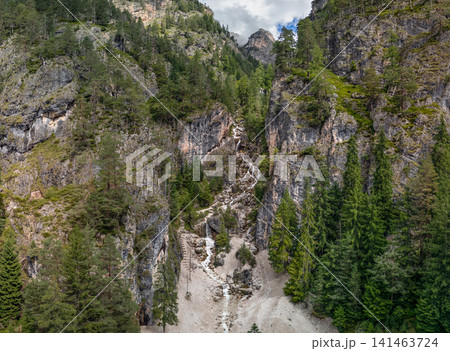 Oblique drone view of the Ciastlins waterfall in a forested gorge in South Tyrol, Italy Oblique drone view of the Ciastlins waterfall in a forested gorge in South Tyrol, Italy 141463724