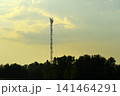 The evening horizon in the clouds and the communications tower. 141464291