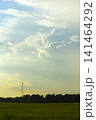 The evening horizon in the clouds and the communications tower. 141464292