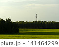 The evening horizon in the clouds and the communications tower. 141464299