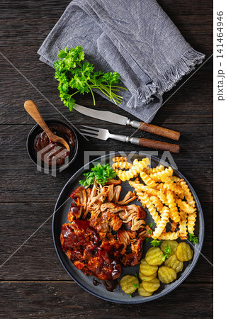 BBQ Shredded Pork Dinner Served With Crispy Fries BBQ Shredded Pork Dinner Served With Crispy Fries 141464946