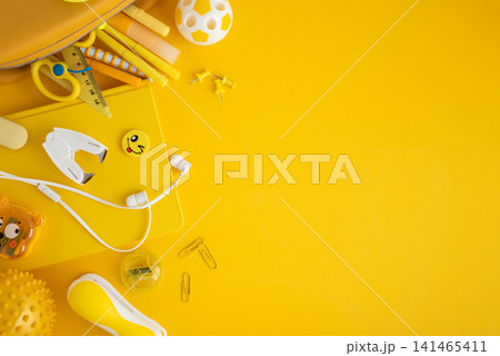 Yellow school and office supplies border on bright background 141465411