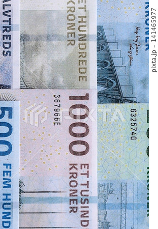 Danish krone paper banknotes pile on table. Denmark DKK currency money bills in big amount Danish krone paper banknotes pile on table. Denmark DKK currency money bills in big amount 141465977
