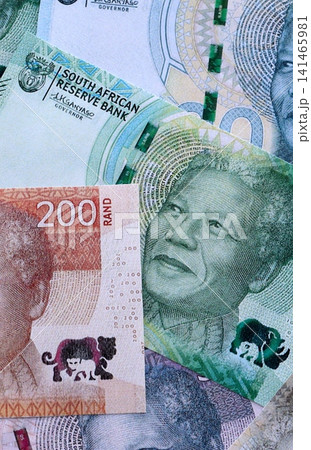 South African rand paper banknotes pile on table. South Africa ZAR currency money bills in big amount South African rand paper banknotes pile on table. South Africa ZAR currency money bills in big amount 141465981