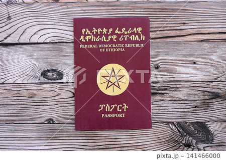Ethiopian passport on table. Official identification document book for citizens of Ethiopia Ethiopian passport on table. Official identification document book for citizens of Ethiopia 141466000