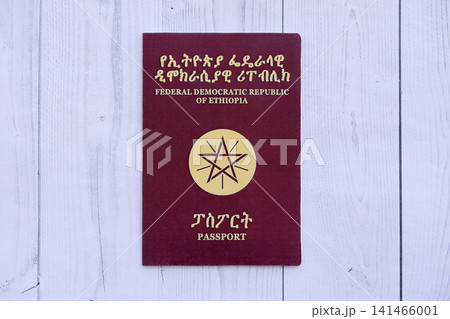Ethiopian passport on table. Official identification document book for citizens of Ethiopia Ethiopian passport on table. Official identification document book for citizens of Ethiopia 141466001