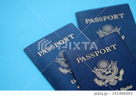 Many US passports on table. Official identification document books for citizens of United States Many US passports on table. Official identification document books for citizens of United States 141466003