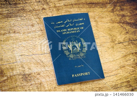 Afghan passport on table. Official identification document book for citizens of Afghanistan 141466030