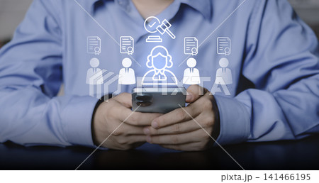 Businessman using smartphone for digital legal services. Glowing icons of lawyer, gavel, and certified documents for professional advice, compliance, and justice system Businessman using smartphone for digital legal services. Glowing icons of lawyer, gavel, and certified documents for professional advice, compliance, and justice system 141466195