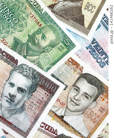 Cuban peso money bills pile on table. Cuba banknotes of CUP currency close up. Concept of business 141466262