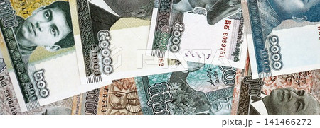 Cambodian riel money bills pile on table. Cambodia banknotes of KHR currency close up Cambodian riel money bills pile on table. Cambodia banknotes of KHR currency close up 141466272