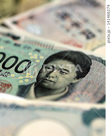 Japanese yen money bills pile on table. Japan banknotes of JPY currency. Concept of business 141466274