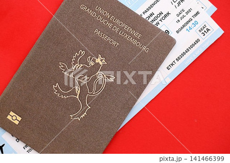 Luxembourg passport and airlines boarding pass tickets. Travel flights and avia tourism in Europe 141466399