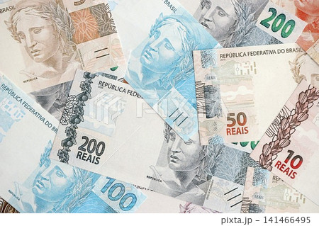 Brazilian reais banknotes. The current Brazil real money bills lies on table in big amount 141466495