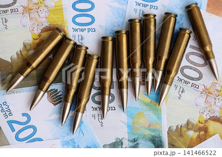 Israel New Shekels banknotes and bullets. The current Israel money bills and ammo Israel New Shekels banknotes and bullets. The current Israel money bills and ammo 141466522