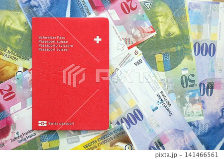 Swiss franc banknotes and passport. The current francs money bills and biometrical pass Swiss franc banknotes and passport. The current francs money bills and biometrical pass 141466561