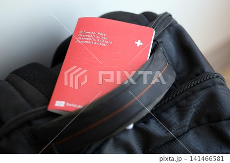 Swiss passport on travel bag. Pass on bag close up Swiss passport on travel bag. Pass on bag close up 141466581