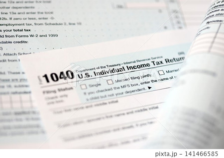 1040 US individual income tax return form blank close up. Few pages of united states tax blank 1040 US individual income tax return form blank close up. Few pages of united states tax blank 141466585