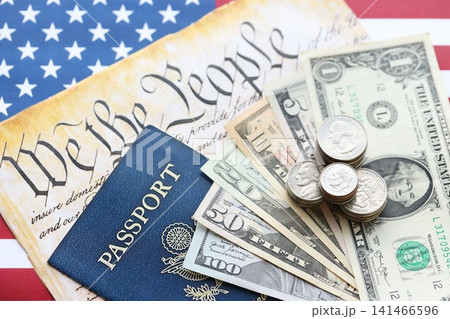 American US dollars money bills and passport with american flag 141466596