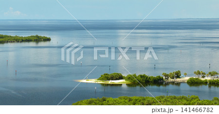 Overhead view of Everglades swamp with green vegetation between water inlets. Natural habitat of many tropical species in Florida wetlands Overhead view of Everglades swamp with green vegetation between water inlets. Natural habitat of many tropical species in Florida wetlands 141466782