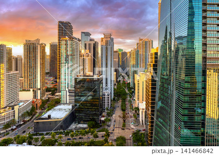 Miami downtown office district in Florida, USA at sunset. High commercial and residential skyscraper buildings in modern American city Miami downtown office district in Florida, USA at sunset. High commercial and residential skyscraper buildings in modern American city 141466842