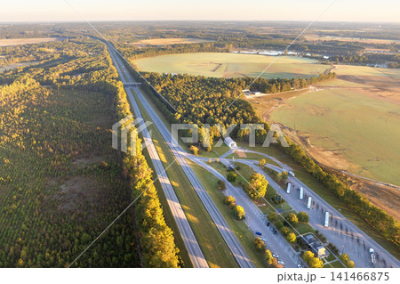 Large truck stop rest area on interstate freeway for trucks overnight parking. Recreational place during long traveling Large truck stop rest area on interstate freeway for trucks overnight parking. Recreational place during long traveling 141466875