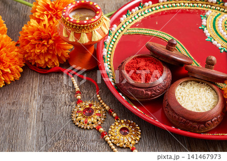 Rakhi festival thali with kumkum, rice, and decorated rakhi 141467973