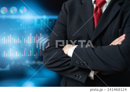 A businessman in a suit and data graphs. Business and economic management. Financial audit, risk management. A businessman in a suit and data graphs. Business and economic management. Financial audit, risk management. 141468124