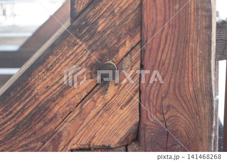 Traditional wooden dowel joint in a rustic timber frame close up Traditional wooden dowel joint in a rustic timber frame close up 141468268