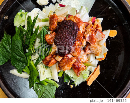 Spicy Korean Chicken Stir Fry Dakgalbi with Vegetables on Iron Pan 141469523