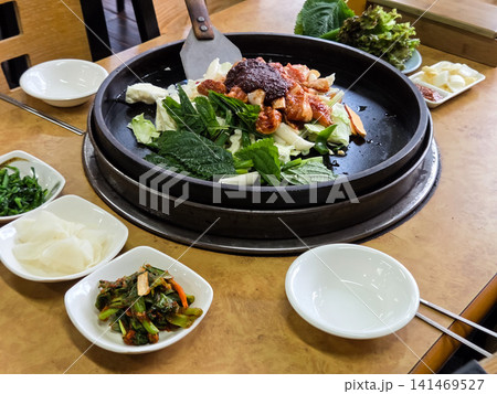 Spicy Korean Chicken Stir Fry Dakgalbi with Vegetables on Iron Pan Spicy Korean Chicken Stir Fry Dakgalbi with Vegetables on Iron Pan 141469527
