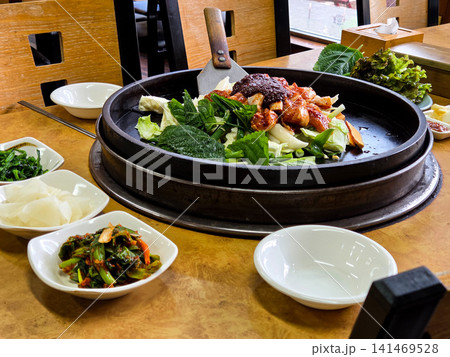 Spicy Korean Chicken Stir Fry Dakgalbi with Vegetables on Iron Pan Spicy Korean Chicken Stir Fry Dakgalbi with Vegetables on Iron Pan 141469528