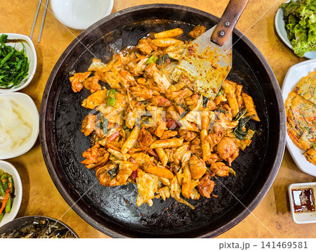 Spicy Korean Chicken Stir Fry Dakgalbi with Vegetables on Iron Pan Spicy Korean Chicken Stir Fry Dakgalbi with Vegetables on Iron Pan 141469581