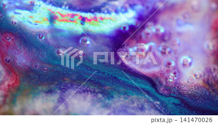 Rainbow ink flow. Blur sparkling liquid. Colorful neon glow fluid mixing in purple blue shiny uneven bubble abstract texture background. Rainbow ink flow. Blur sparkling liquid. Colorful neon glow fluid mixing in purple blue shiny uneven bubble abstract texture background. 141470026