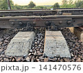 Sturdy Railway Tracks with Concrete Sleepers at Golden Hour 141470576
