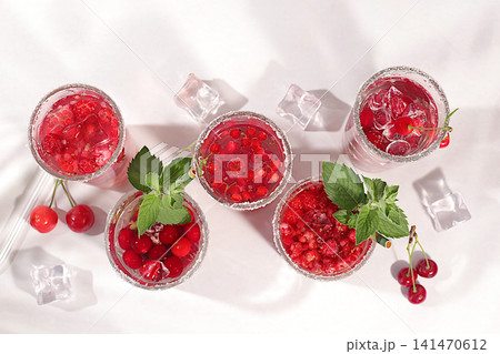 Dietary vegan water with raspberries, currants, and cherries, detox water, mojito with Sprite, mint, and fresh berries. Detox diet and weight loss concept, healthy lifestyle advertising, 141470612