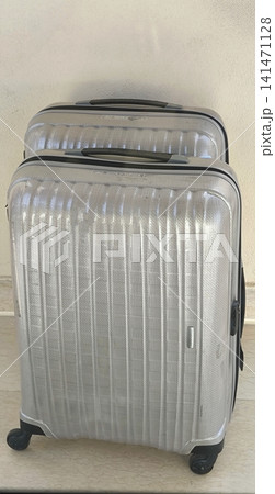 Silver plastic carry-on suitcases. Travel and vacation. Silver plastic carry-on suitcases. Travel and vacation. 141471128