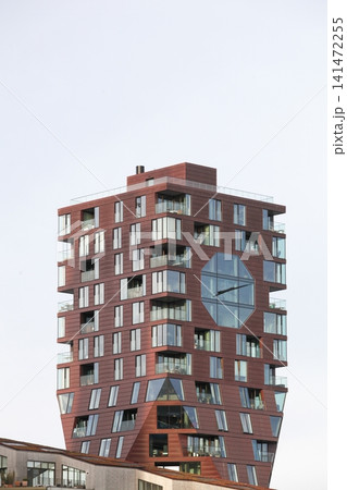 View of Kampanilen or clock tower building. Kampanilen is a large residential development located at Bassin 7 in the Aarhus island district 141472255